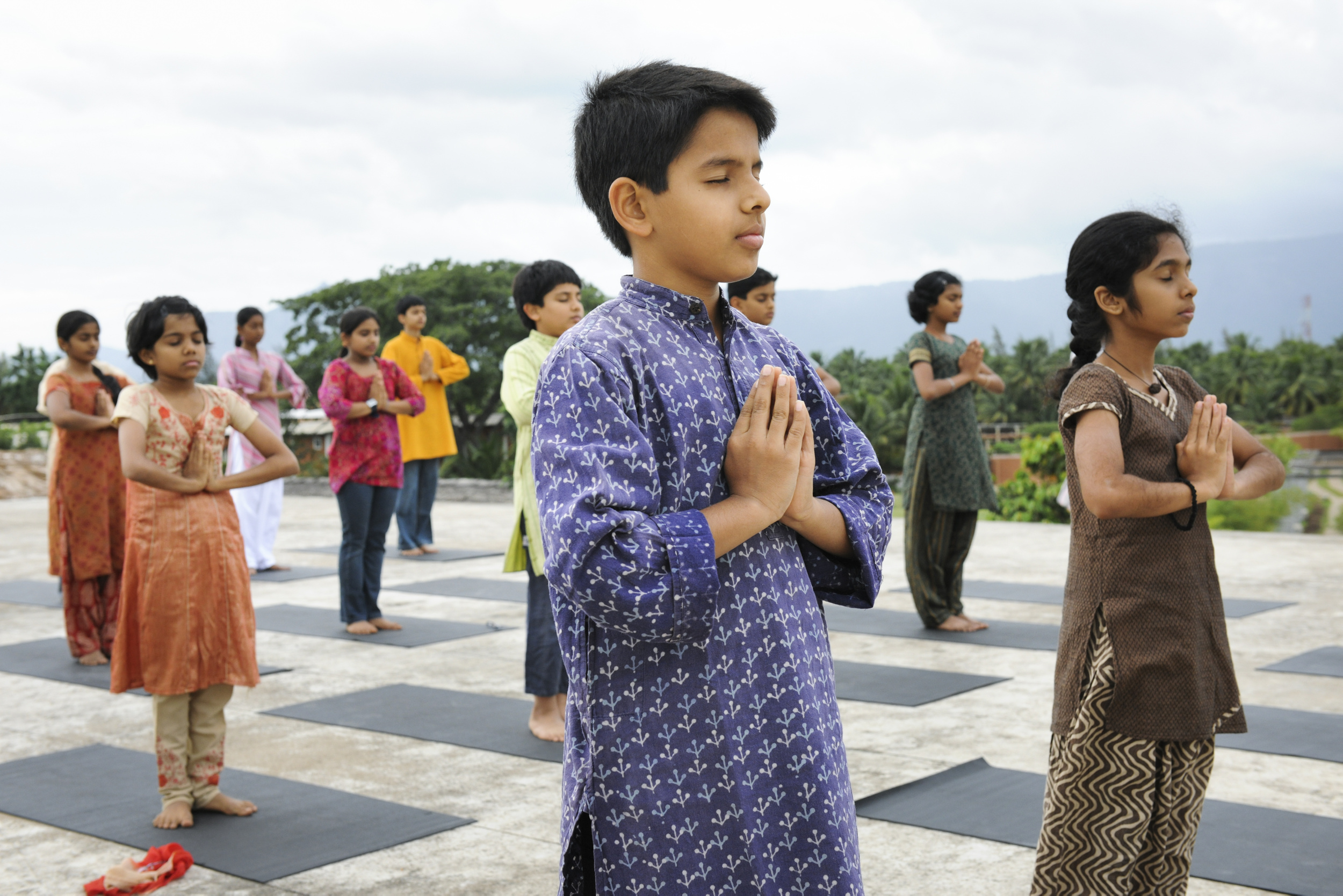 kids doing Isha Yoga